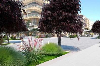 Bari, via Argiro rifiorisce tra alberi e cespugli di fiori rosa e bianchi