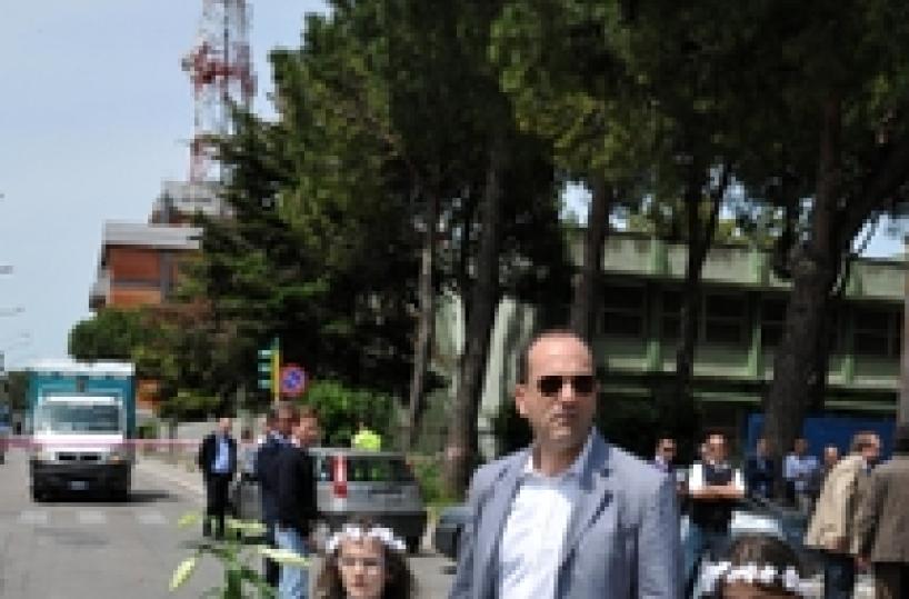 Muslim tailors sew tunics for first communions